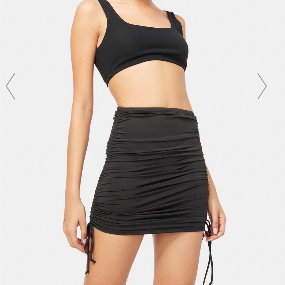 NWOT Dolls Kill Black ruched mini skirt size small